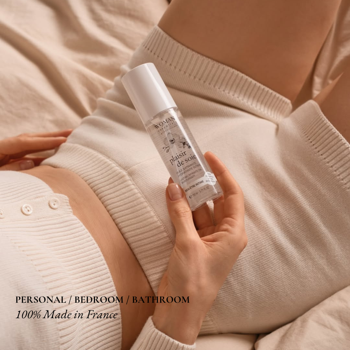 Person holding a skincare product with text about personal, bedroom, bathroom use and French origin.